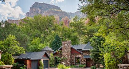 Creekside Chateau, patio overlooks Oak Creek, with steps directly to the water