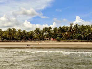 On the beach, sun-loungers, beach towels - Beachfront Villa CocoSol • Private Pool • Peaceful Oceanfront Getaway (Esterillos Oeste)