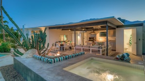 A modern house with a swimming pool, outdoor seating, and a kitchen area. - PS Butterfly: Well-Styled, Authentic Mid-Century Home (Palm Springs)