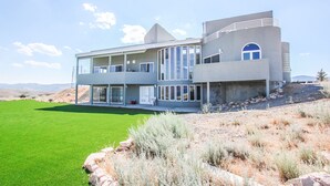 A modern two-story house with a flat roof, large windows, and a covered patio area. - King Of The Mountain, Panoramic View, allows UP TO 40 Guests Completely Seclude (Laketown)