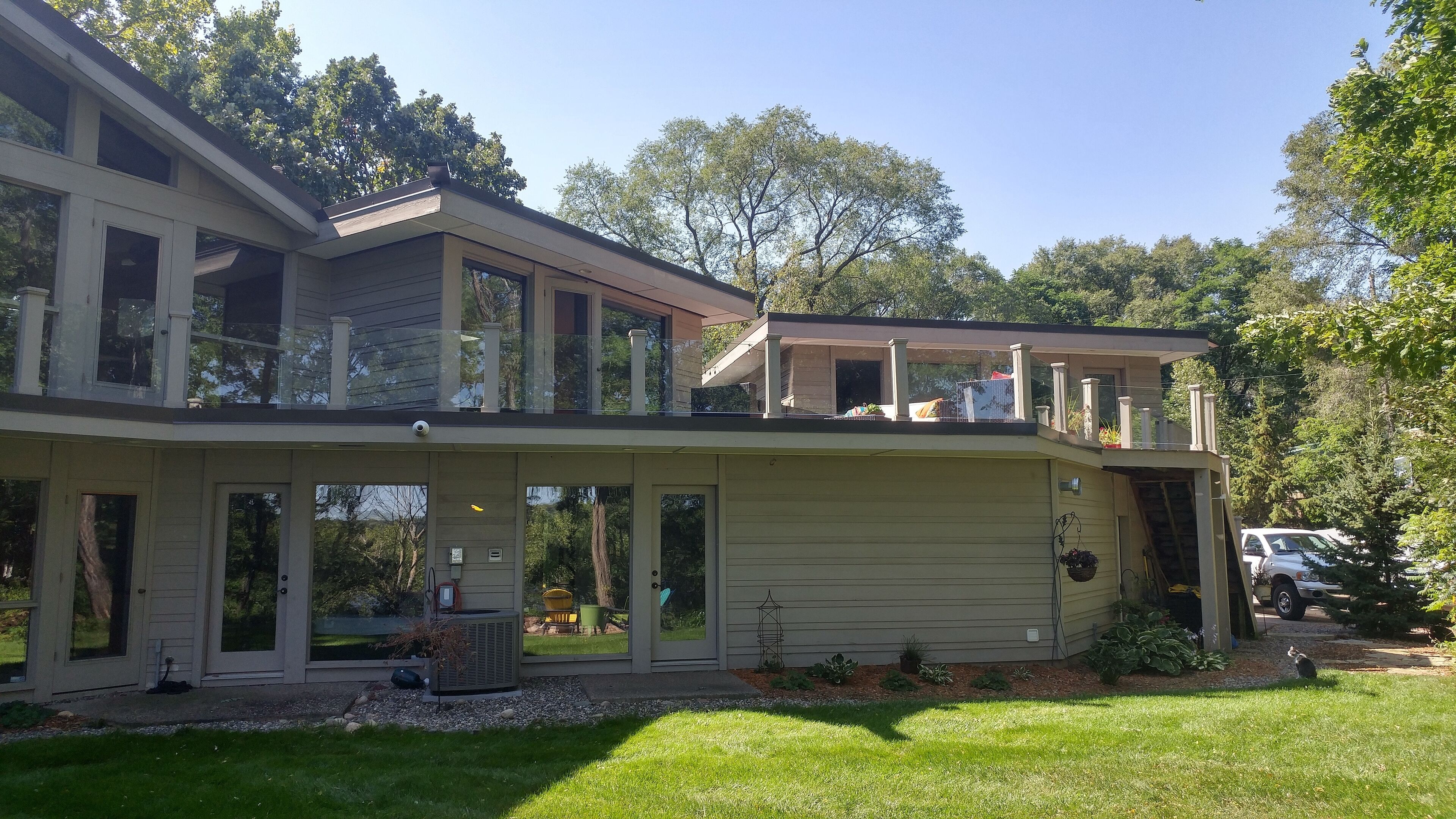 View of guest house on the right and attached to the main house via large deck.