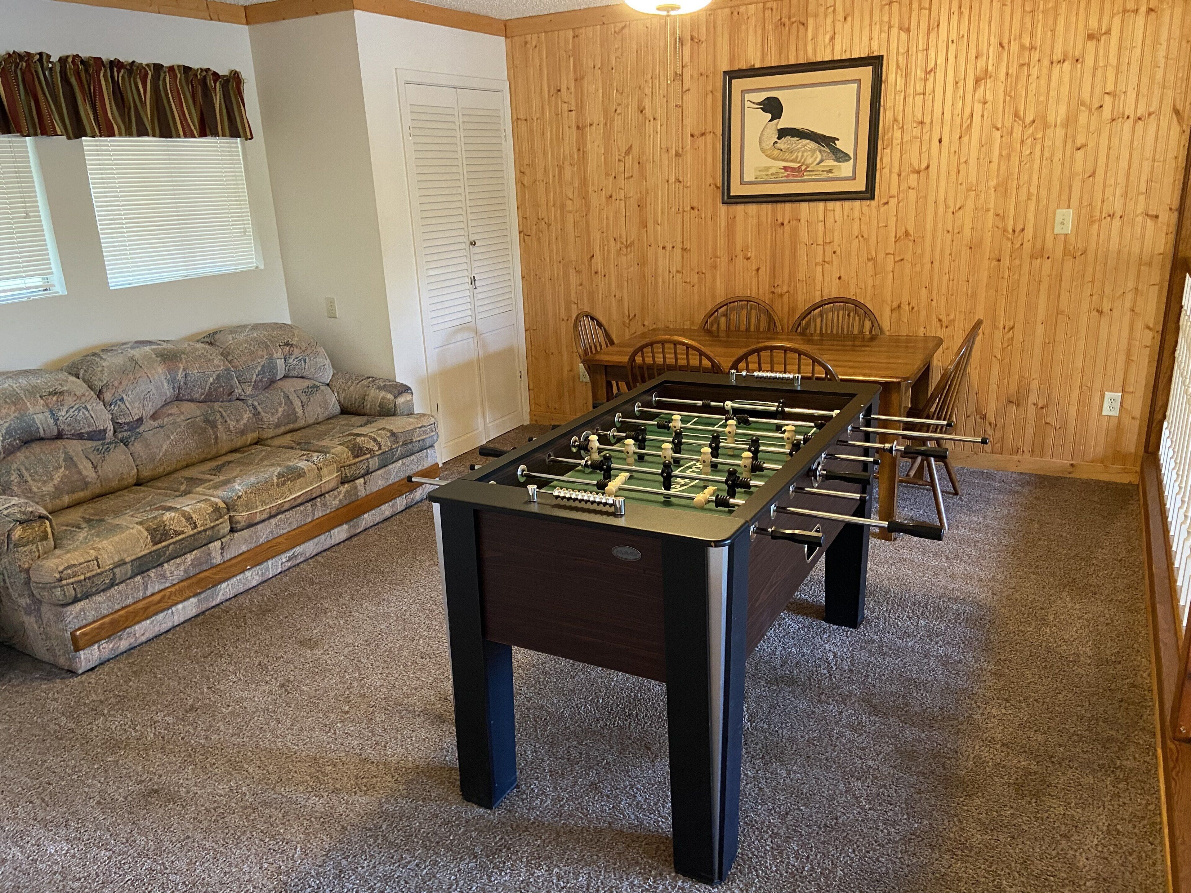 Loft which doubles as a game room and sleeping area with a queen sleeper/sofa. 