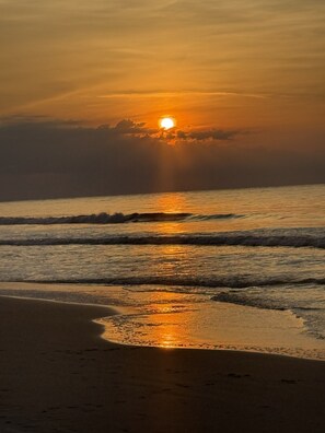 On the beach, sun-loungers