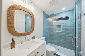 Shower, hair dryer, towels, soap