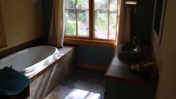 Bathtub, jetted bath, hair dryer, towels