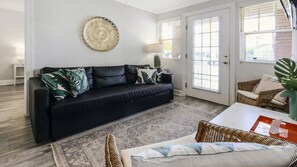TV, books - 2 Bedroom Pet-Friendly Stay, Pool & Beach Access (St Pete Beach)