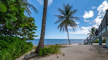On the beach, sun loungers, beach towels