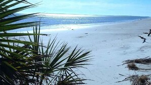 A beach with clear skies and calm waters.