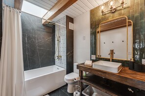Bathtub, hair dryer, towels
