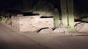 A stone wall with numbers 5120, 5140, and 5100. - Sahuaro Ranch Hideaway (Tucson)