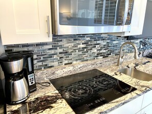 Fridge, microwave, stovetop, coffee/tea maker