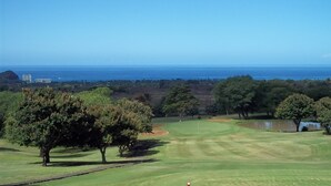 A golf course with a pond, trees, and a view of the ocean. - Affordable Luxury, Gorgeous One Bedroom Condo, Amazing Views and Great WiFi (Waianae)