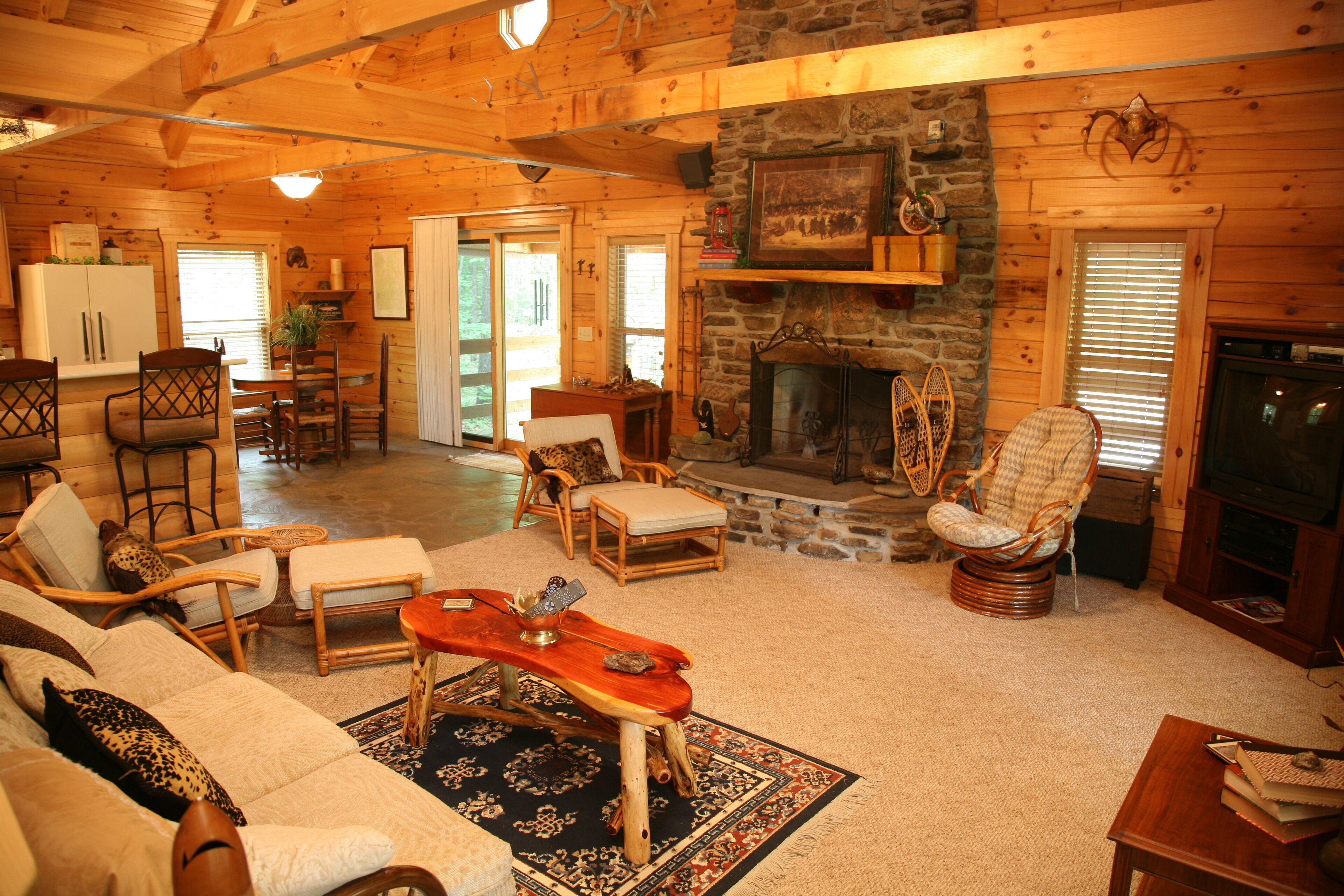 2 story log cabin on 50 acres. Large fireplace, hot tub, covered porch.