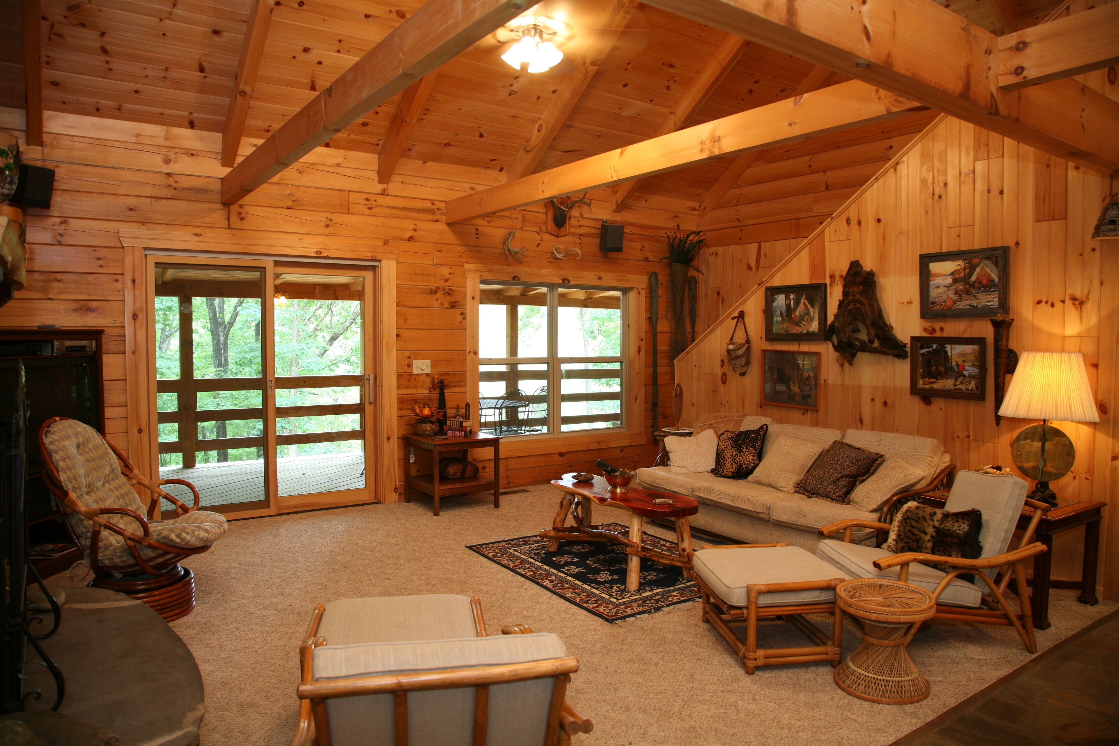 2 story log cabin on 50 acres. Large fireplace, hot tub, covered porch.