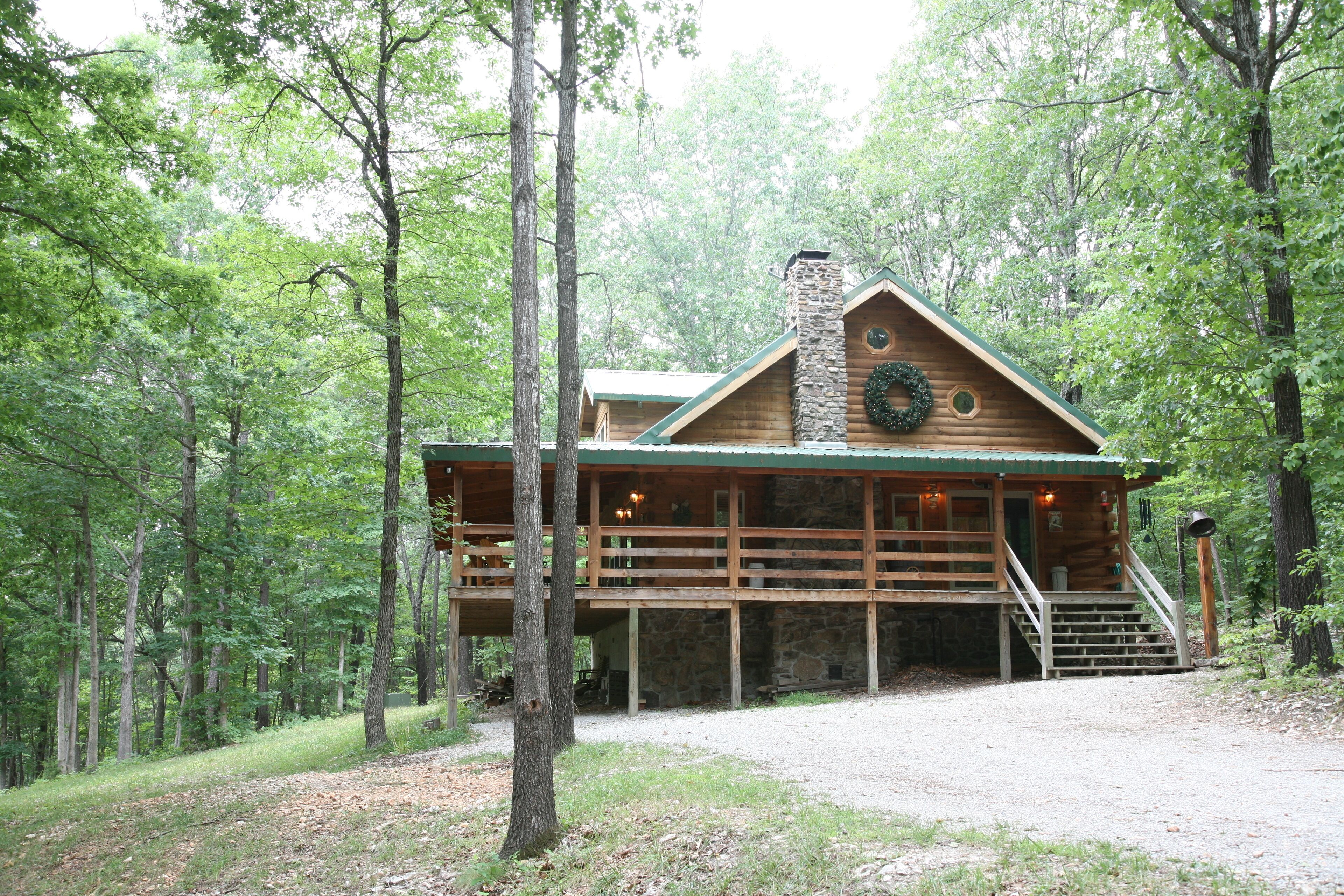 2 story log cabin on 50 acres. Large fireplace, hot tub, covered porch.