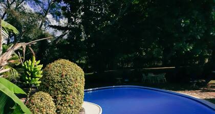 Beautiful garden villa. Family friendly. Just a short walk to a private beach.