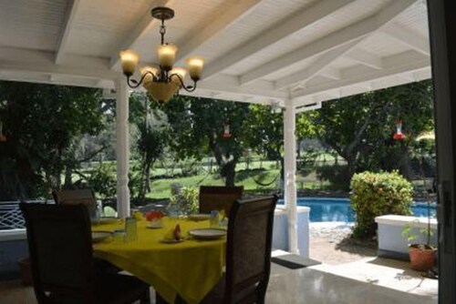Beautiful garden villa. Family friendly. Just a short walk to a private beach. 