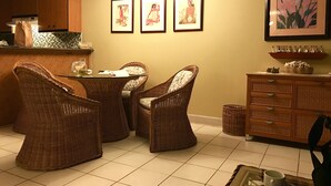 A dining area with wicker chairs, a table, and a kitchen in the background. - Your paradise - entire > 800 square feet apartment with affordable rate  (Kihei)