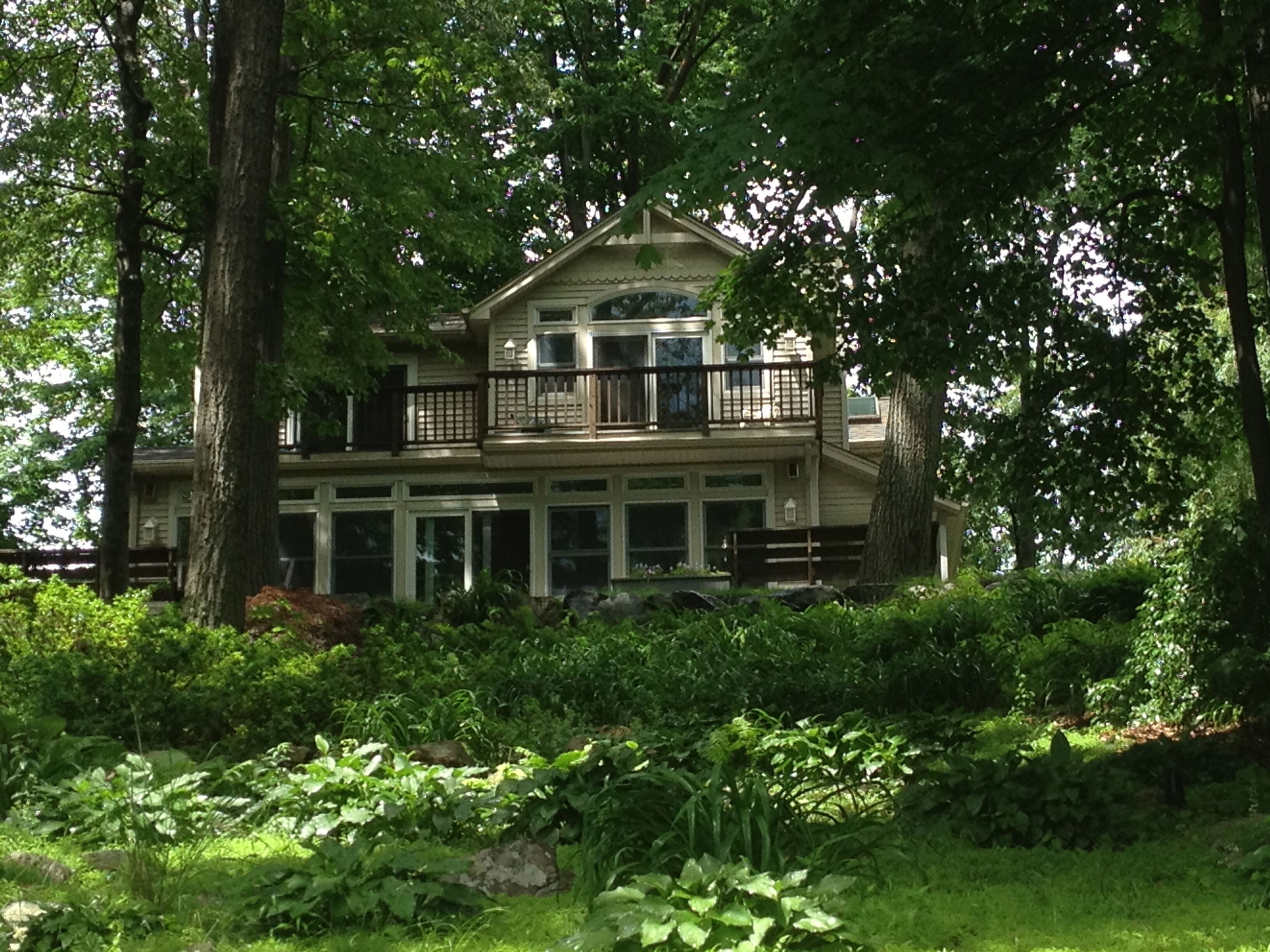 Lakefront home with a wall of windows facing Upper Greenwood Lake.