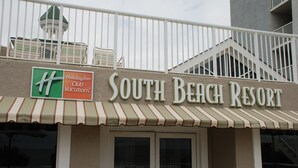 The exterior of South Beach Resort with a Holiday Inn Club Vacations sign. - South Beach Resort-Beautiful Beach Resort for Family Fun!! (Myrtle Beach)