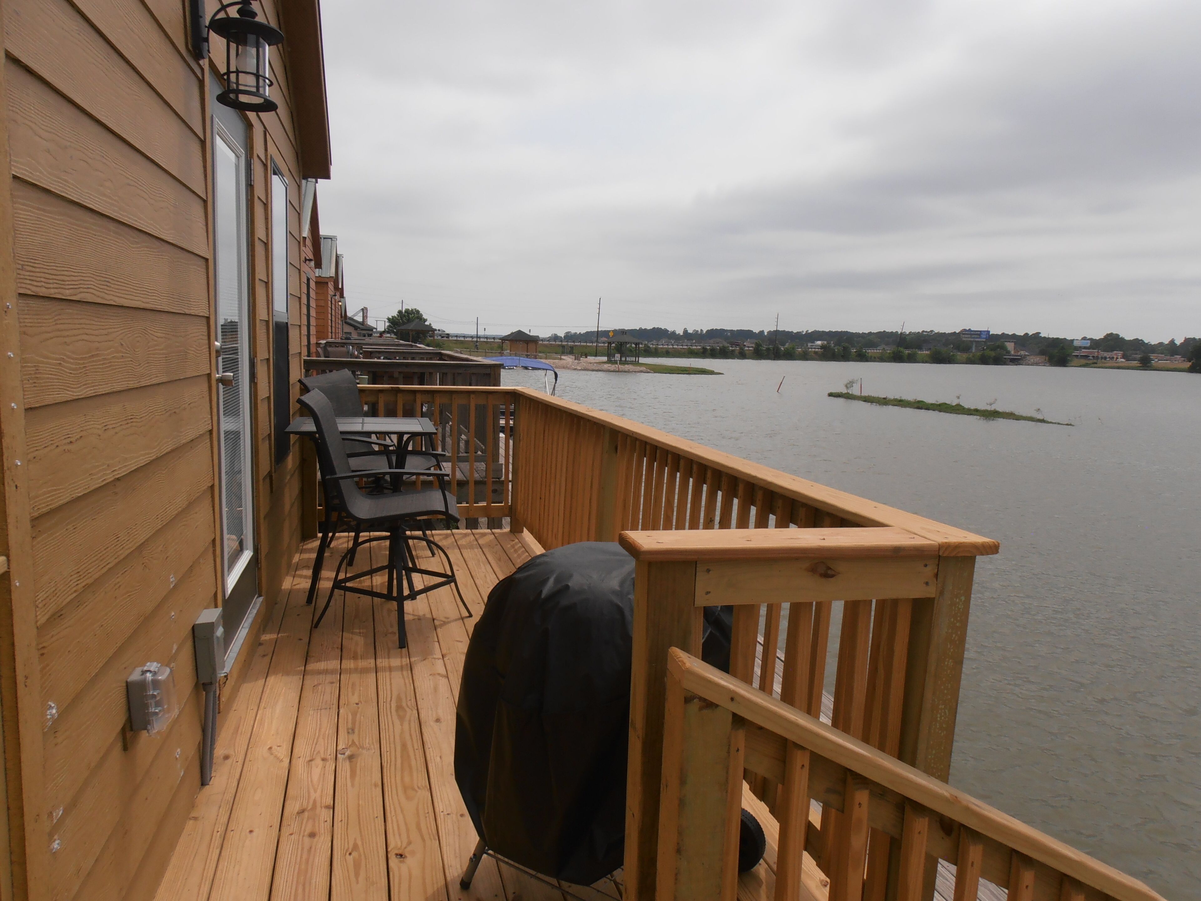 Cozy Lake House located on Lake Conroe.  Fish from the porch!