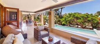 Beautiful Adobe Built House with Ocean View, Solar Heated Pool, and Great Garden