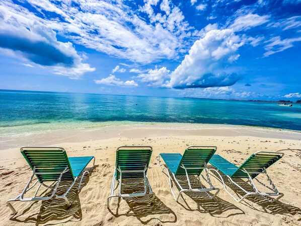 On the beach, sun loungers, beach towels