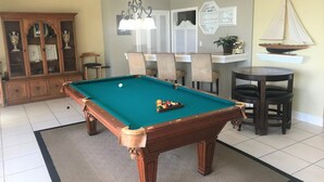 A pool table with a green felt surface, surrounded by a beige carpet. - Bay Front - 'Villa La - Vue', Incredible Bay & Golf Course Views!  Sleeps 15. (Miami Beach)