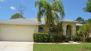 A single-story house with a garage, a well-maintained lawn, and a palm tree. - Large 3 Brd Briarwood Lake-View Pool Villa
NEWLY renovated Bathroom (Naples)
