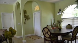 A dining area with a round table, chairs, and a vase of flowers. - Large 3 Brd Briarwood Lake-View Pool Villa
NEWLY renovated Bathroom (Naples)