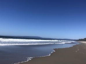 On the beach, sun-loungers