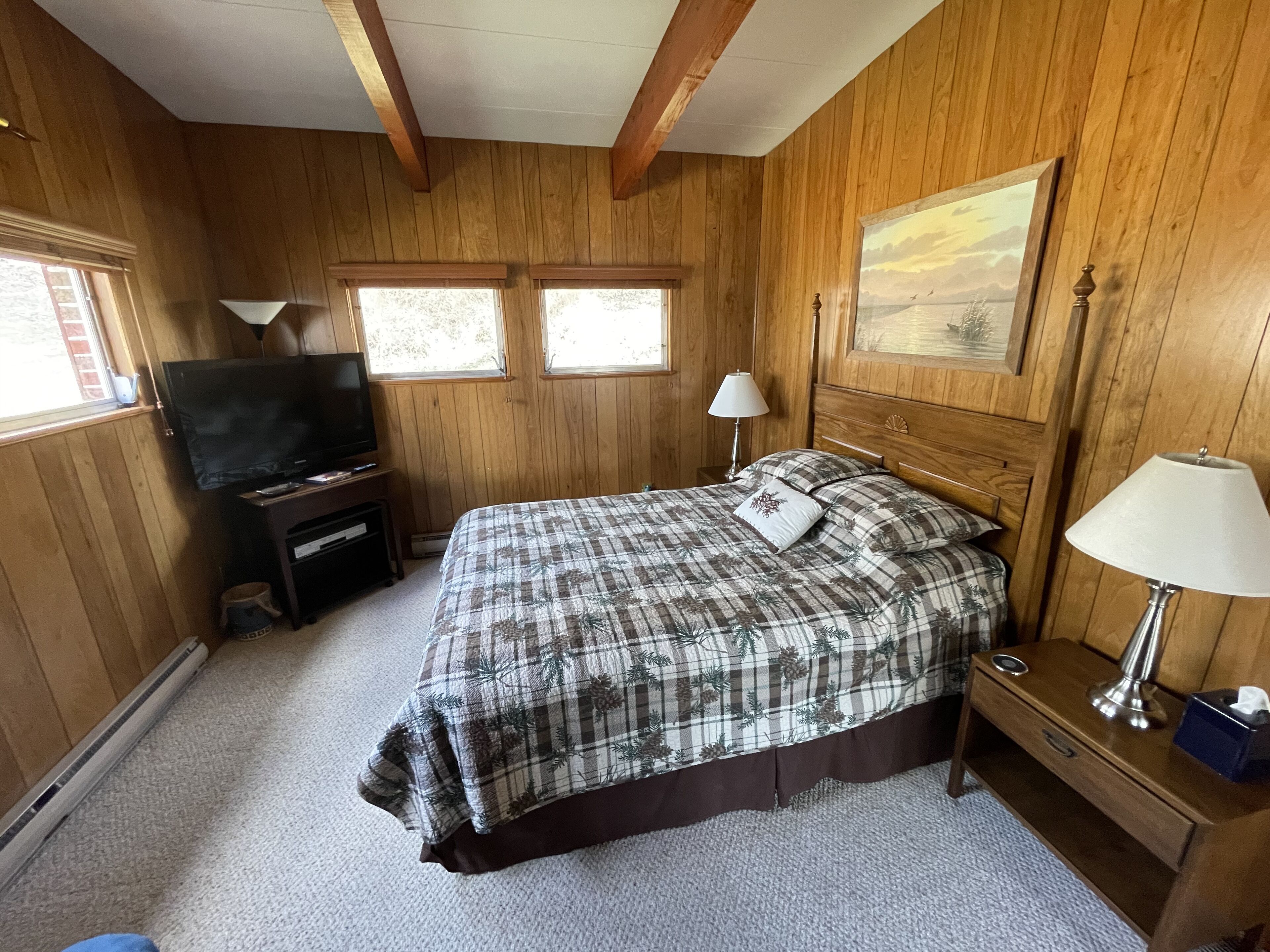 Secluded 5 BR brick ranch with a panoramic  view of the lake through the trees