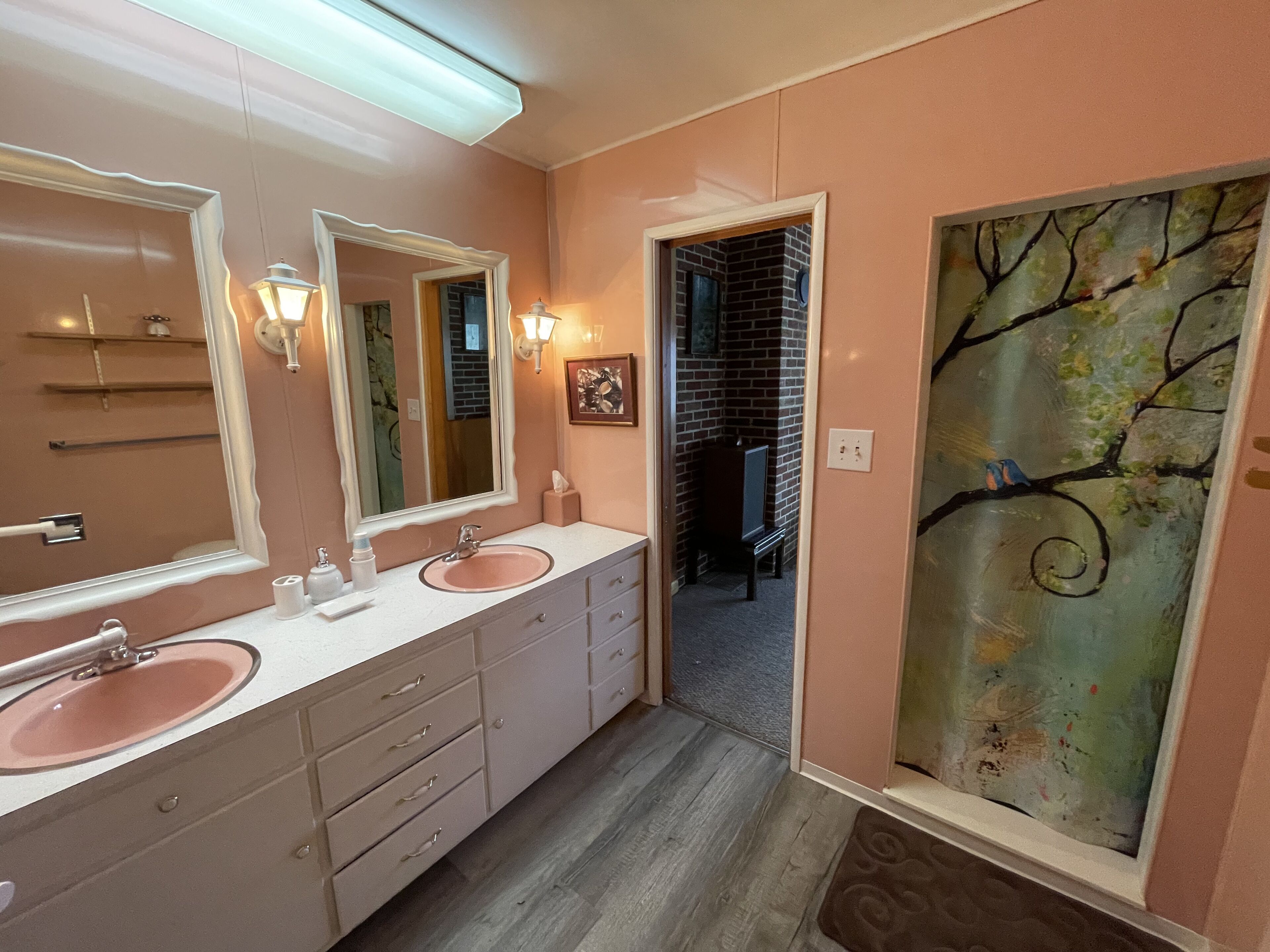 Secluded 5 BR brick ranch with a panoramic  view of the lake through the trees