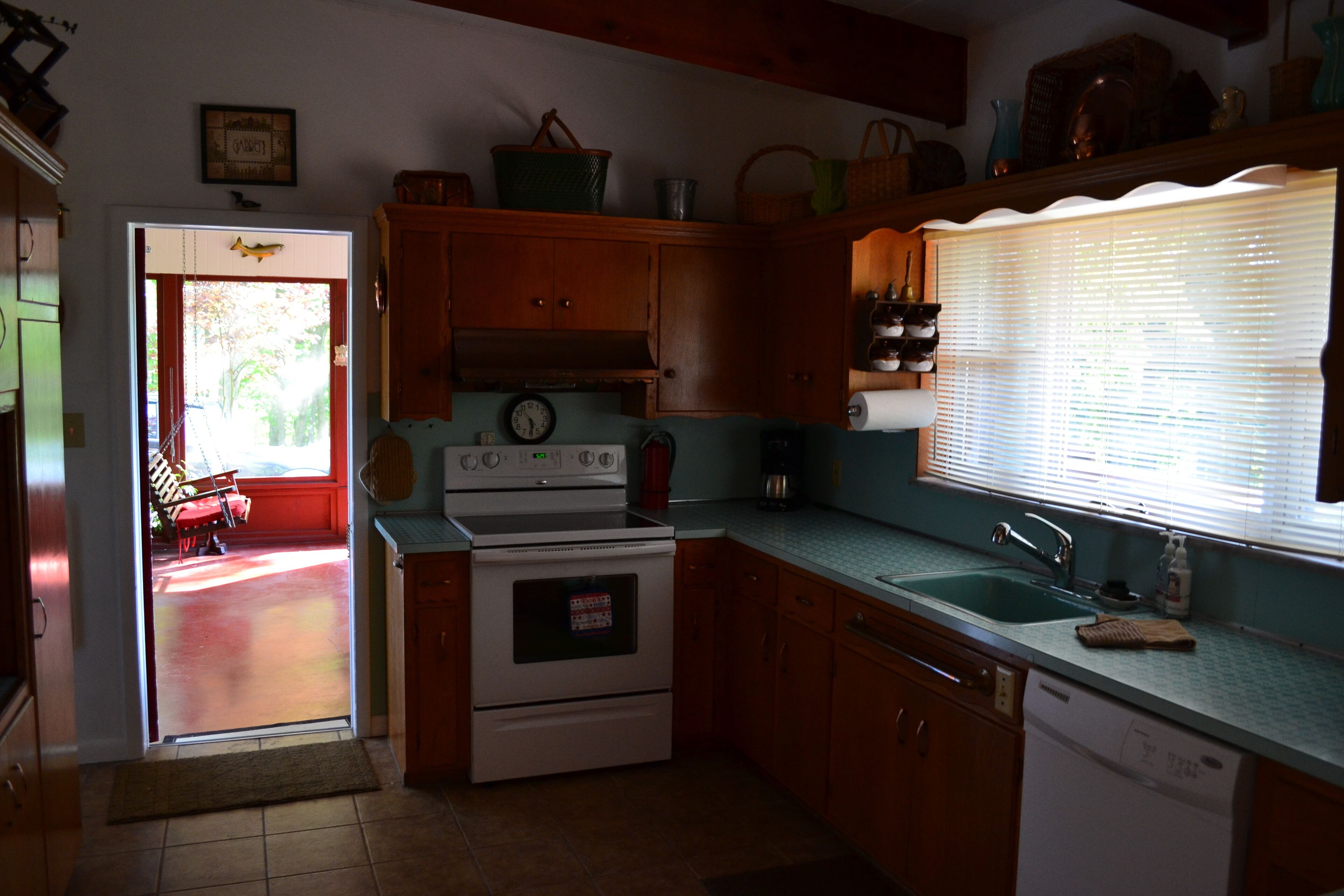 Secluded 5 BR brick ranch with a panoramic  view of the lake through the trees