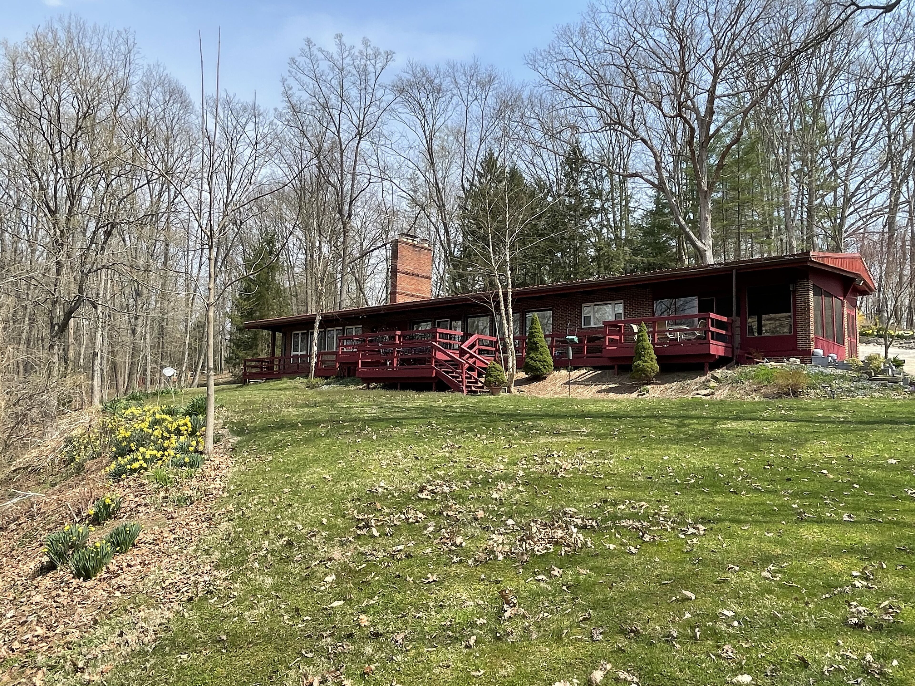 Secluded 5 BR brick ranch with a panoramic  view of the lake through the trees