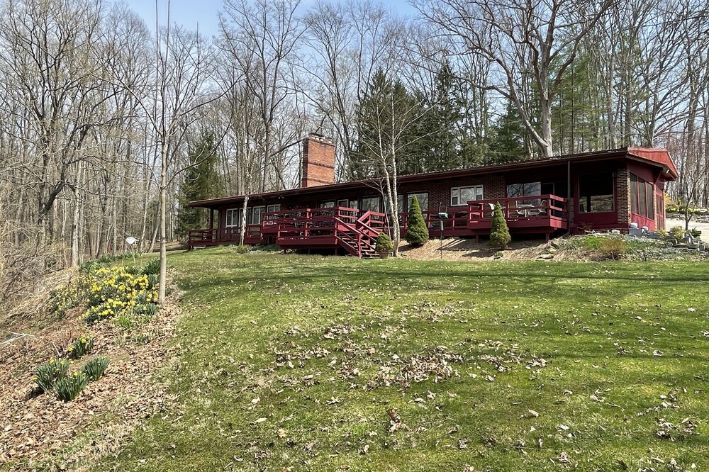 Secluded 5 BR brick ranch with a panoramic view of the lake through the trees