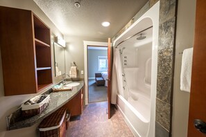Combined shower/bathtub, hair dryer, towels, soap