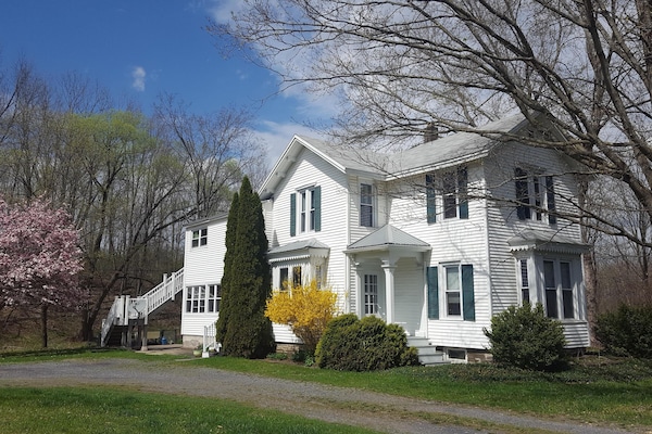 House in springtime - Apt. stairs on the left towards the back of the house