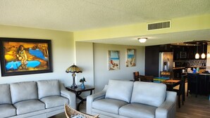 A living room with two sofas, a coffee table, and a painting on the wall. - Luxury Condominium In Key Largo... Sunsets, Marina (Key Largo)