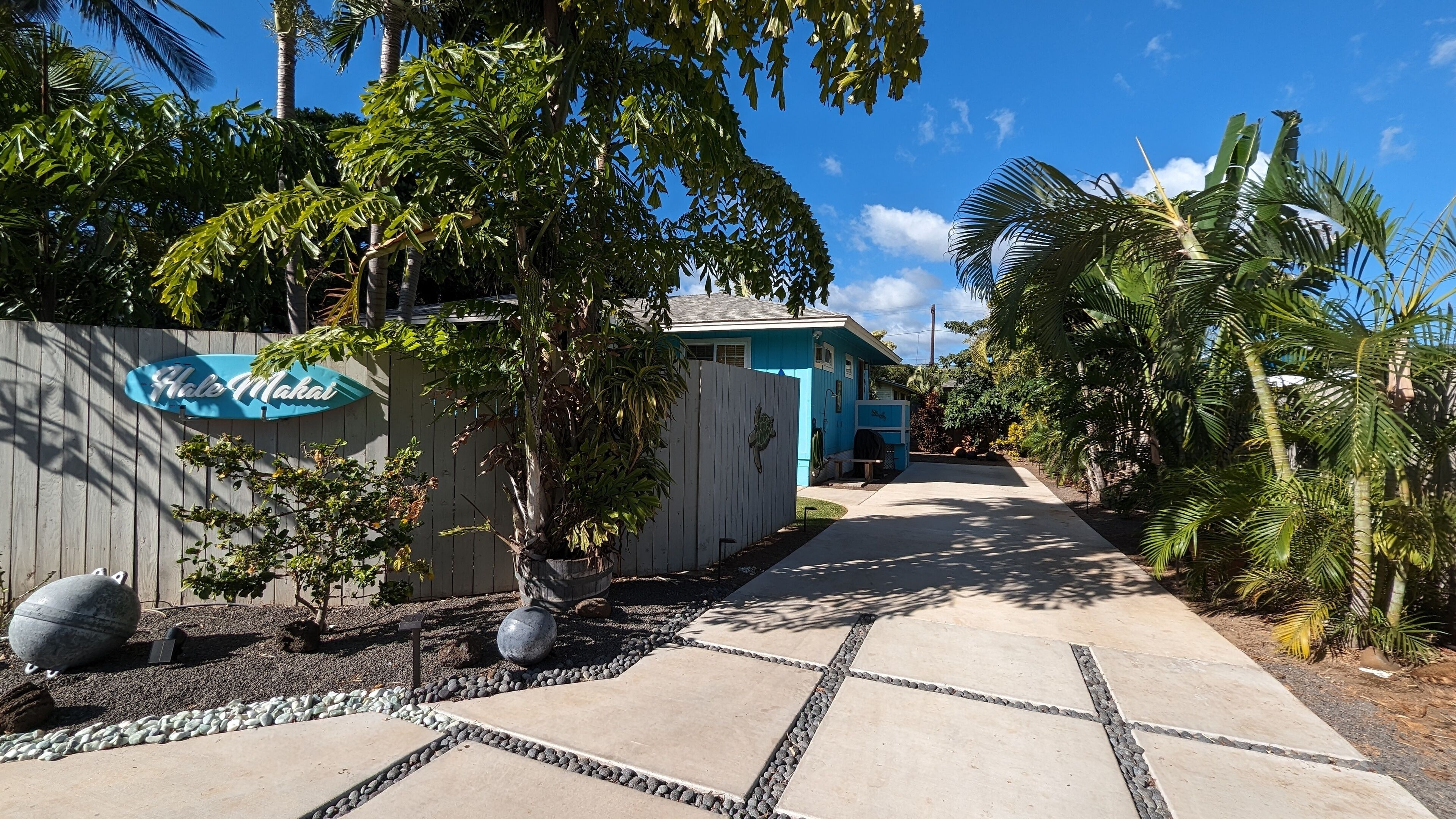 A pathway leading to a building with a sign reading "Hale Makai."