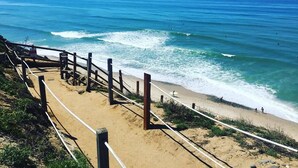 A beach with a wooden fence and a clear view of the ocean. - Beautiful Oceanfront Home, Gorgeous Views, Deck and Patio! Best Value! (Encinitas)