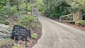 A road sign with a bear silhouette and text indicating Bald Mountain Rd. - Beautiful lodge, 4 king bedrooms, all with private baths! 5 decks to enjoy. (SKY VALLEY)