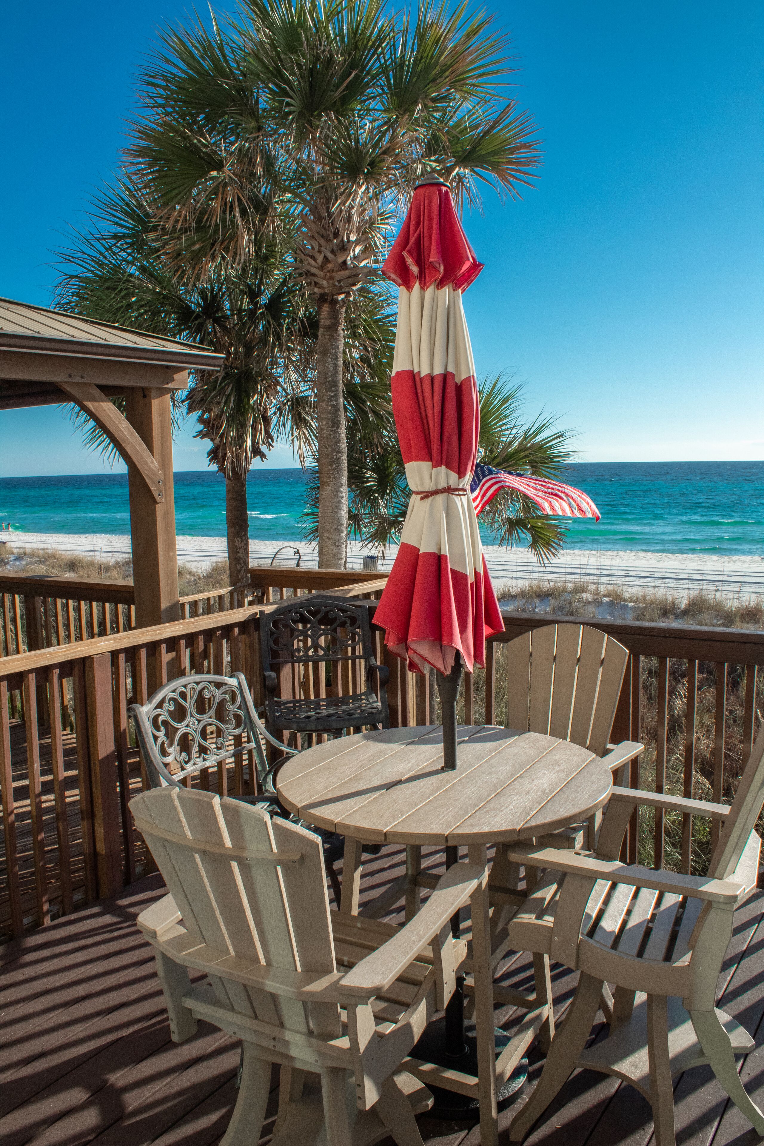 The deck contains captain table, chairs and a grill. 