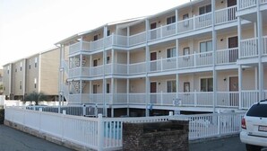 A multi-story motel with white railings and balconies. - Beautiful 2 Bedroom, 2 Bath Ocean View Condo in Surfside Beach (Surfside Beach)