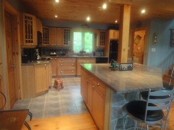 Spacious kitchen with granite and center island