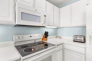 Coffee/tea maker, fridge, microwave, oven