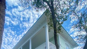 A two-story house with a porch, a wooden deck, and a mailbox. - 5 BR, 5 BA in Seaside, quick walk to the private beach access or main pool  (Santa Rosa Beach)