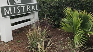 A sign with the word "MISTRAL" and a logo of a plant.