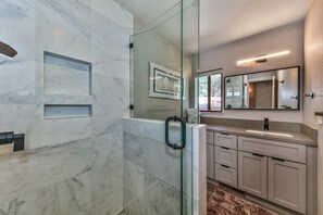 Combined shower/tub, hair dryer, towels, soap