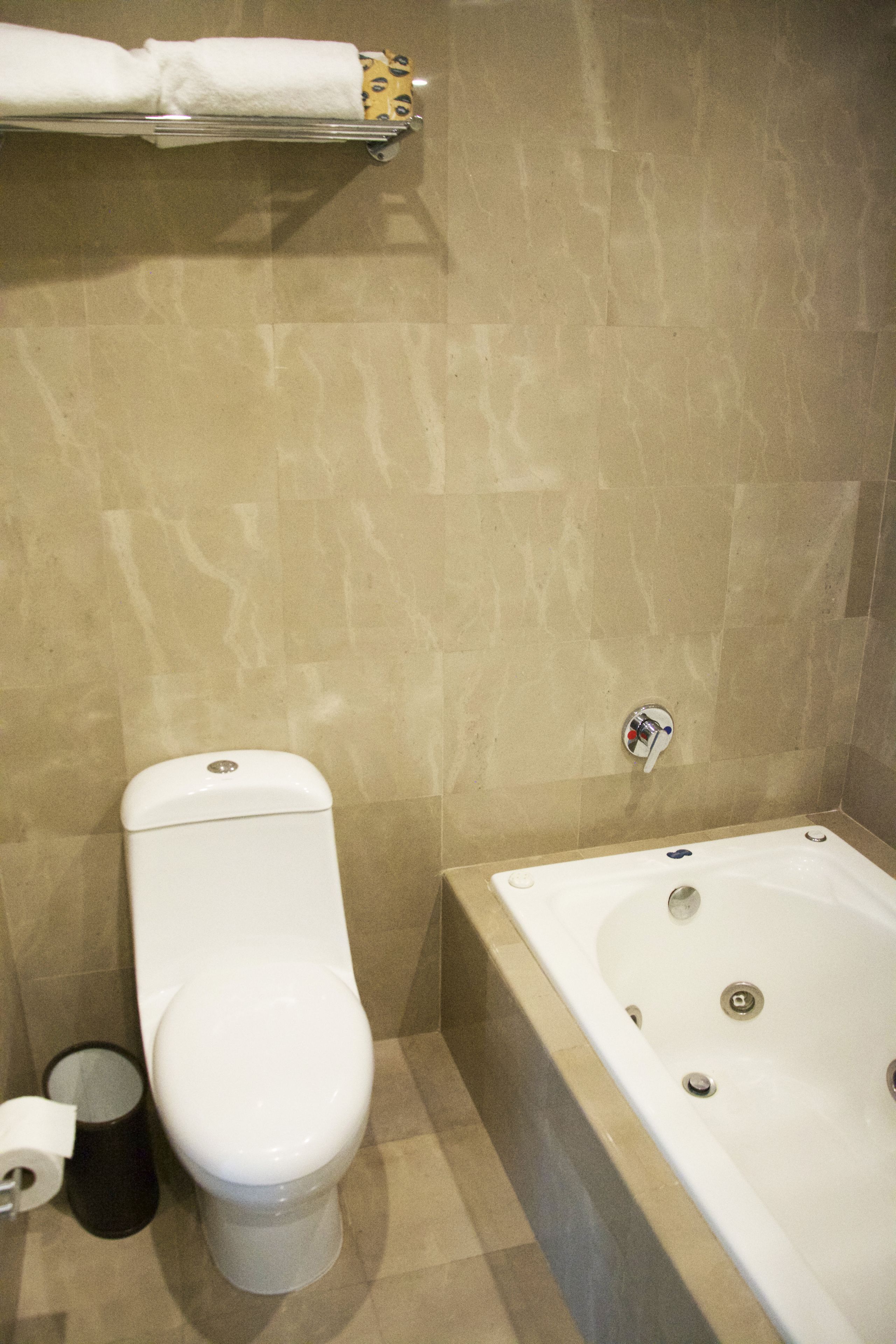 suite, 1 king bed with sofa bed, balcony, partial ocean view (balcony) | bathroom | shower, free toiletries, hair dryer, towels